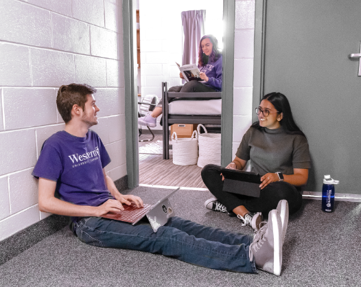 two students outside a residence room